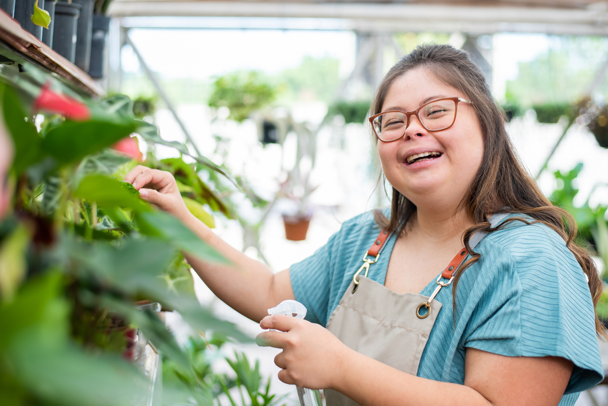 woman with down syndrome working in flower shop